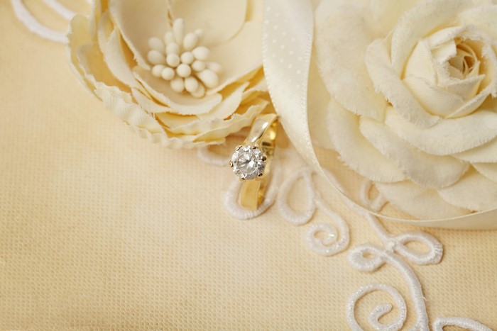 Diamond engagement ring on fabric flowers