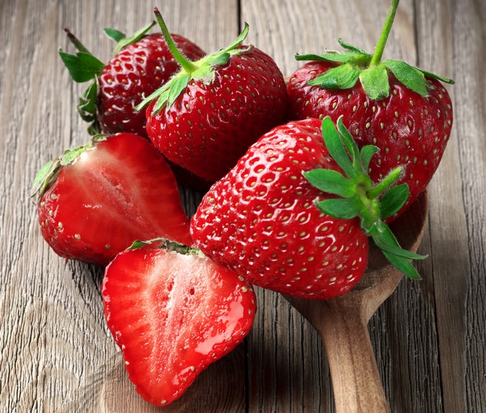 Strawberries on a wooden surface