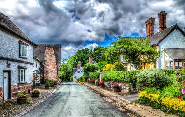Street in Little Budworth, United Kingdom with HDR clouds