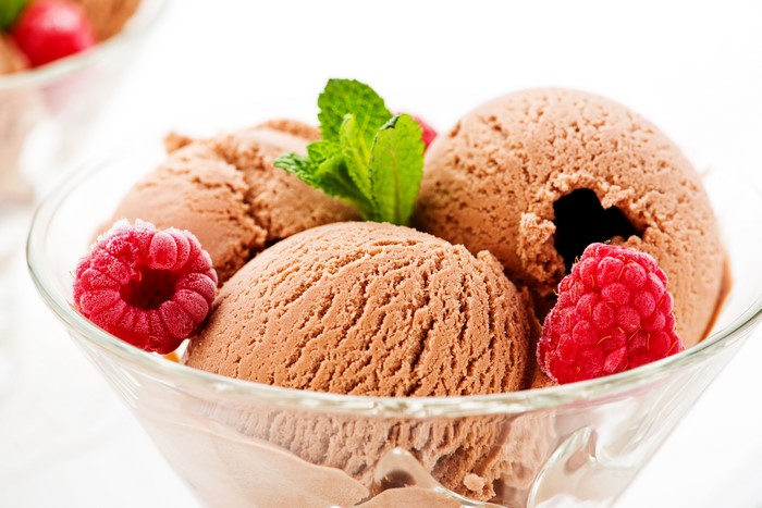 Chocolate ice cream with raspberries and mint