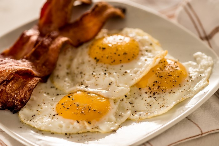 Fried eggs with bacon on a plate