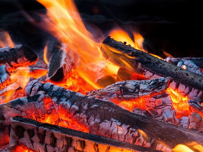 Close-up of burning logs and flames