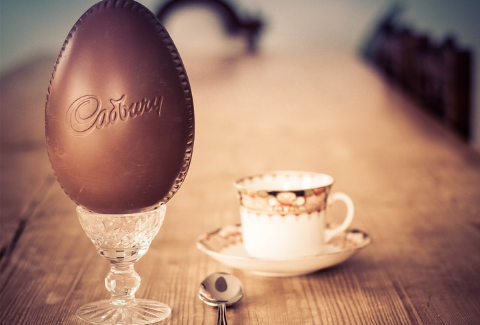 Cadbury chocolate egg with tea cup and spoon