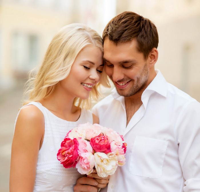 Couple in love with a bouquet of flowers