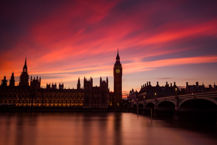 Big Ben and Houses of Parliament at sunset over River Thames, London
