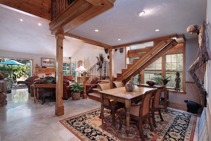 Interior living room with stairs and dining table