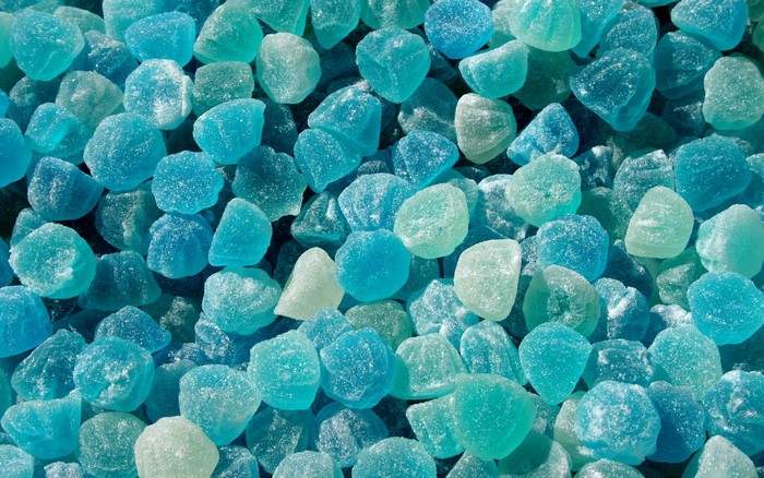 Close-up of many light blue candies
