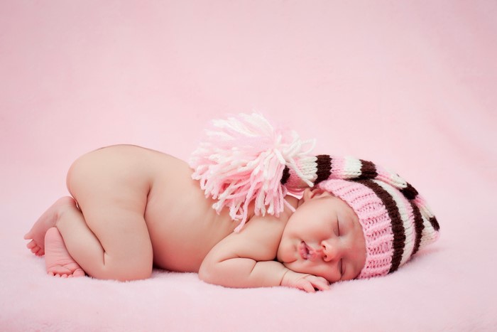 Baby sleeping in a winter hat