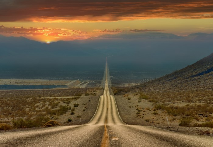 Desert highway at sunset in California, USA