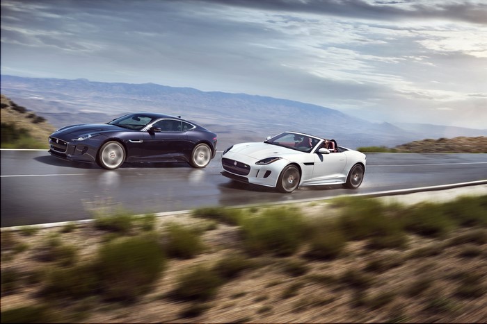 Two Jaguar F-Type cars on a road