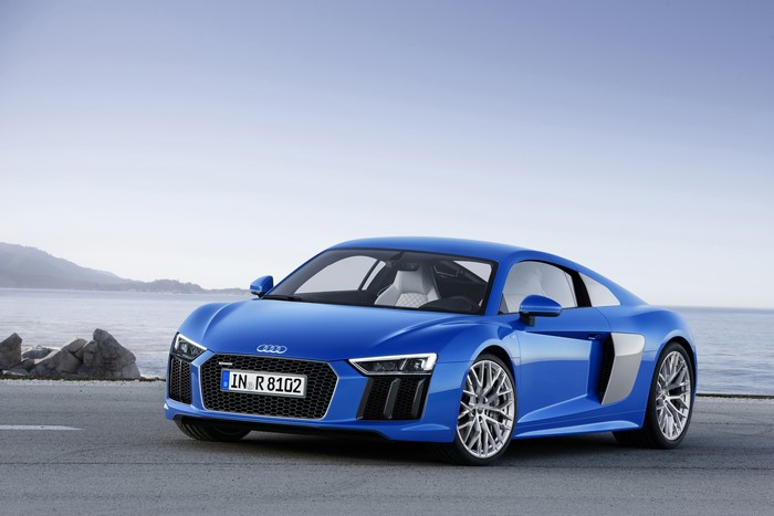 Blue Audi R8 V10 parked by the sea