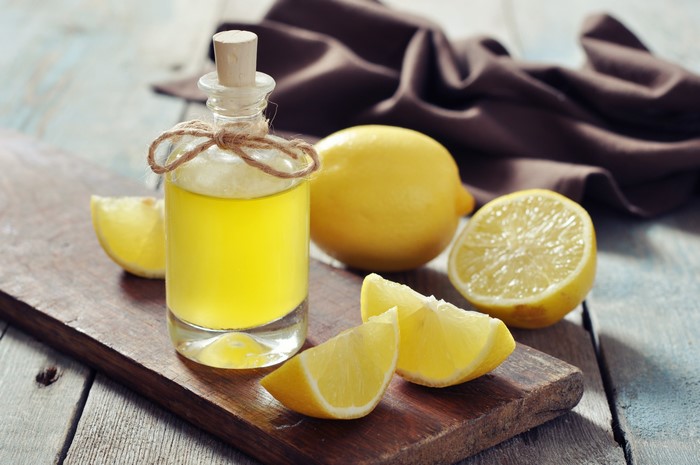 Bottle of Lemon Juice with Lemons