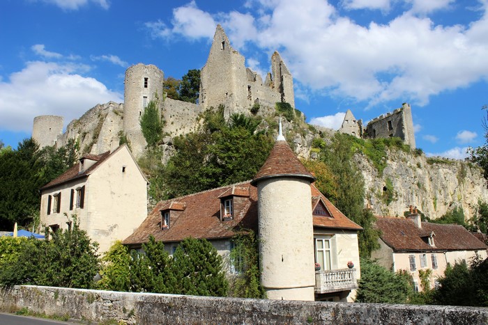 Ruins of Angles-sur-l'Anglin castle above houses, France