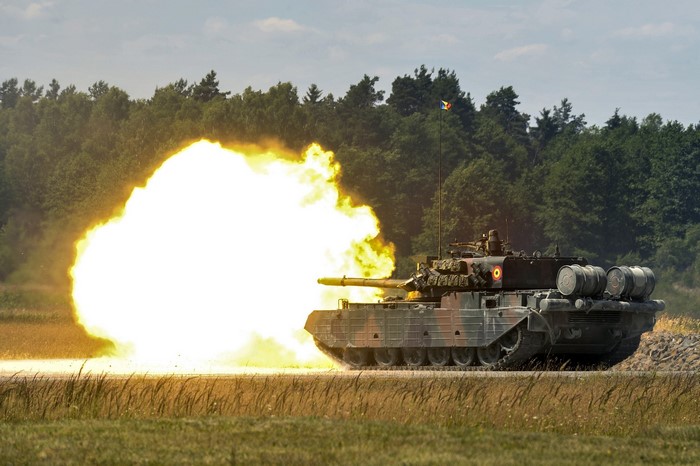 Tank firing a projectile with a large explosion