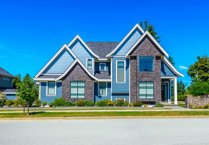 Blue and stone facade of a large modern house