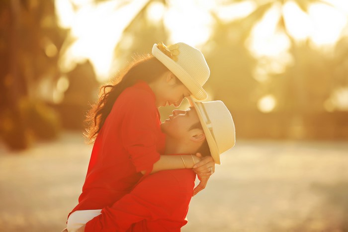 Couple in love wearing hats and red shirts