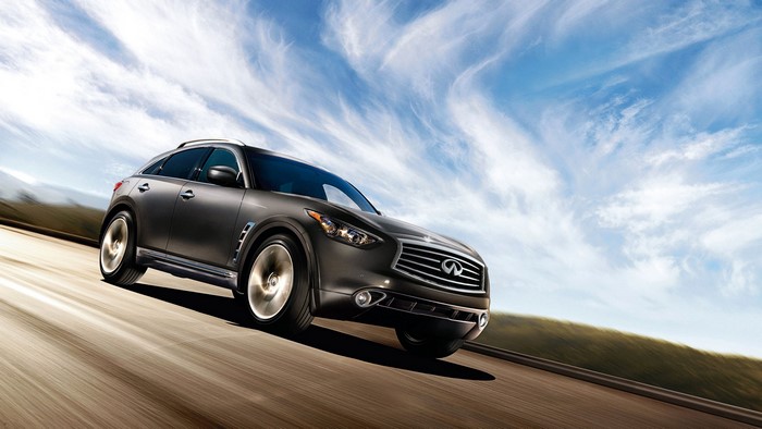 Infiniti FX35 SUV driving on a road
