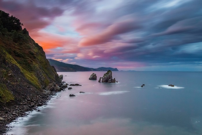 Rocky coastline with sea stacks at sunset