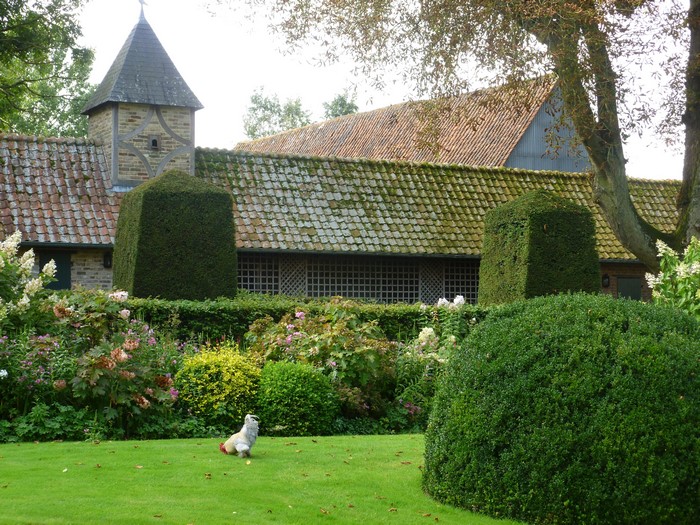 Garden with a building and a gnome