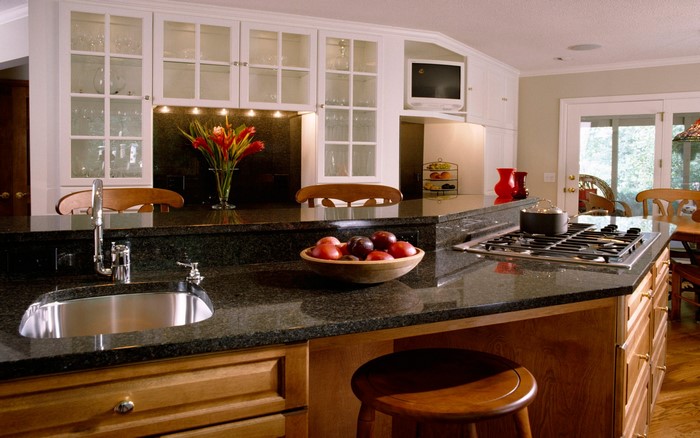 Modern kitchen with granite countertops and island