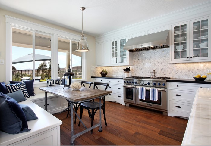 Kitchen with dining nook and stainless steel range