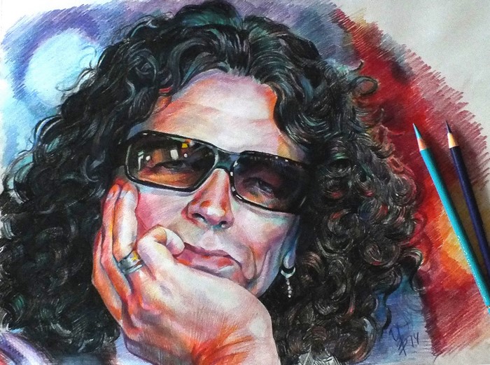 Portrait of Sergei Galanin with curly hair and glasses