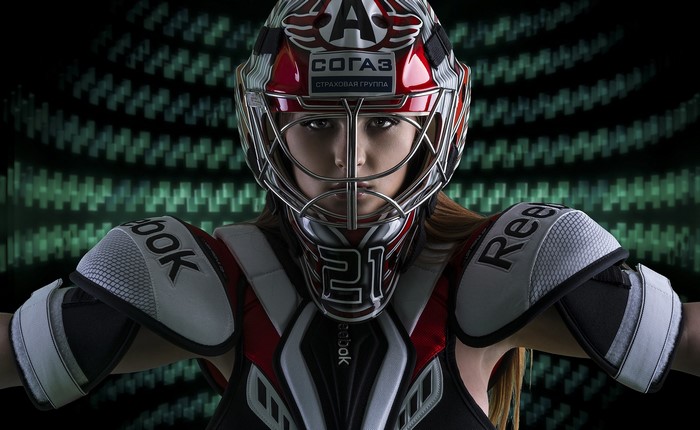 Woman in Hockey Goalie Gear and Helmet