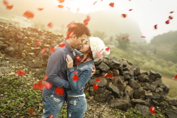 Couple in love with petals falling