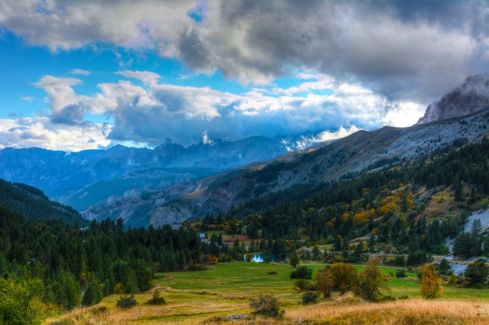 Mountain landscape with trees and clouds in Estenc, France