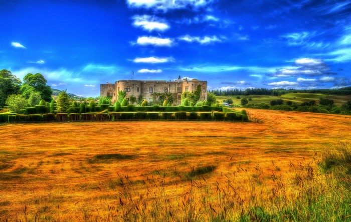 Chirk Castle in Wales with manicured gardens and fields