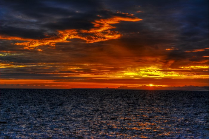 4K Sea Sunset with Dramatic Clouds
