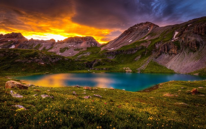 Turquoise lake and mountains at sunset