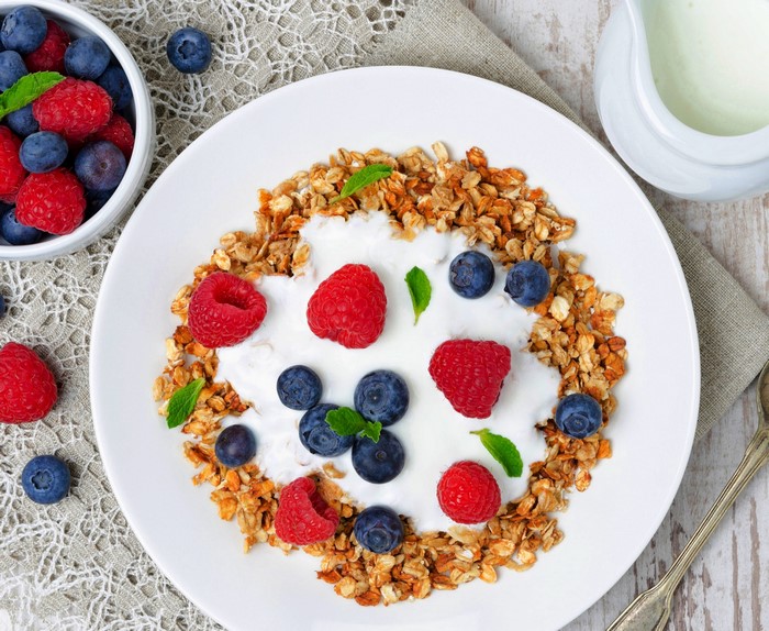 Granola with yogurt and berries on a plate
