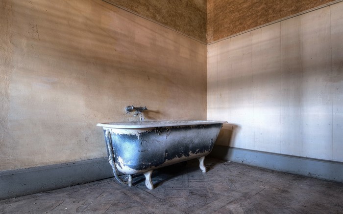 Old bathtub in a derelict room
