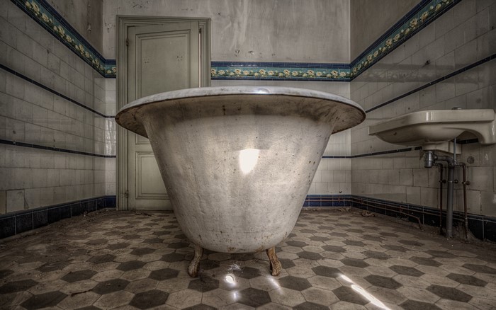 Abandoned bathroom with bathtub and sink