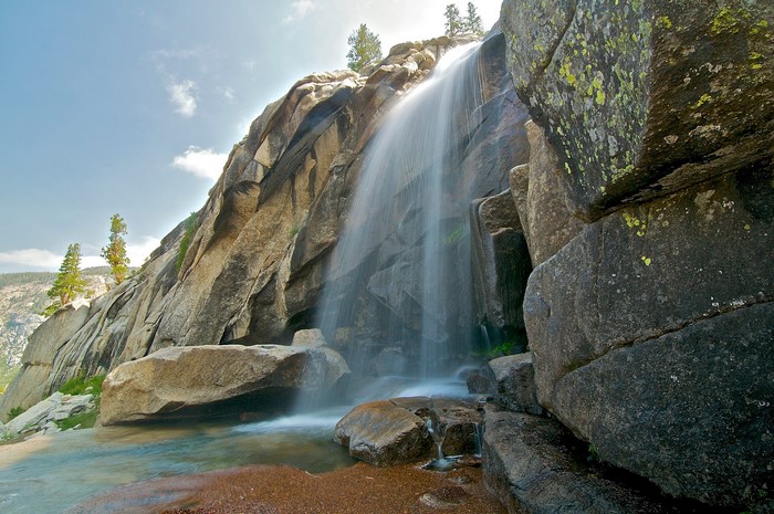 Waterfall cascading over rocky cliff face