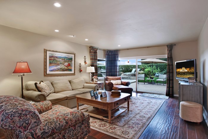 Living room with sofa, armchair, and coffee table