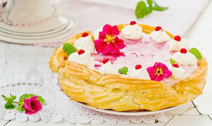 Choux pastry cake with cream and berries