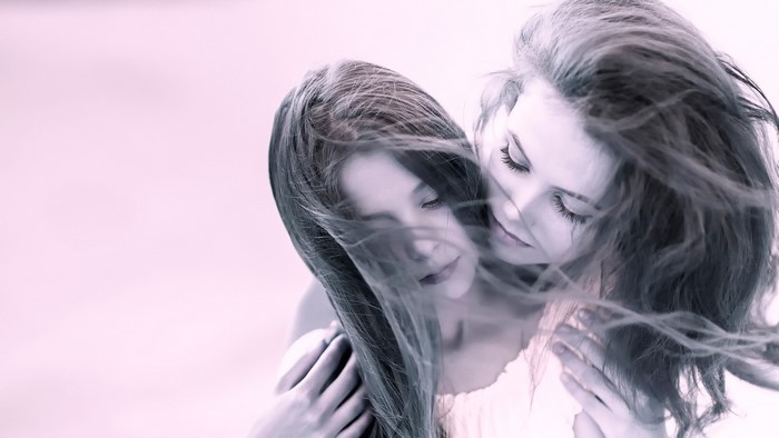 Two young women with windblown hair