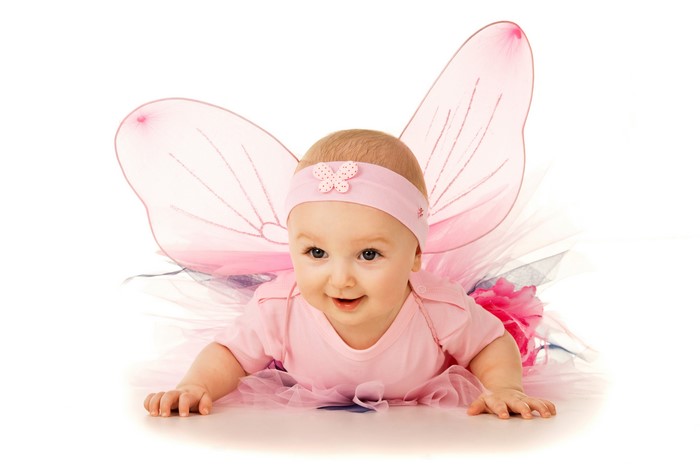 Baby in a pink fairy costume with butterfly wings