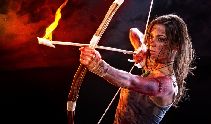Lara Croft from Tomb Raider 2013 with flaming arrow