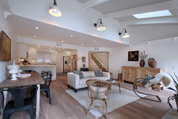 Interior design of a living room with kitchen and dining area