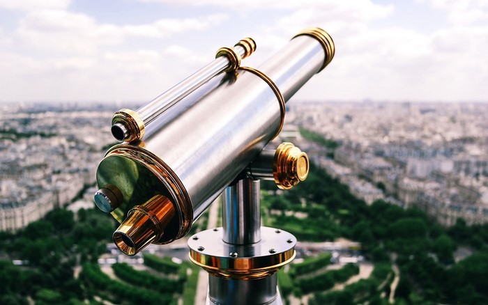 Telescope overlooking a city