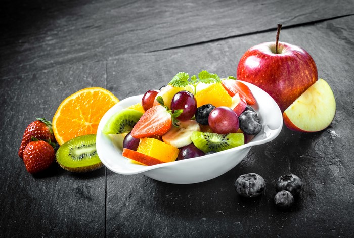 Fruit Salad with Apple, Orange, Strawberries, Kiwi, Blueberries, and Grapes