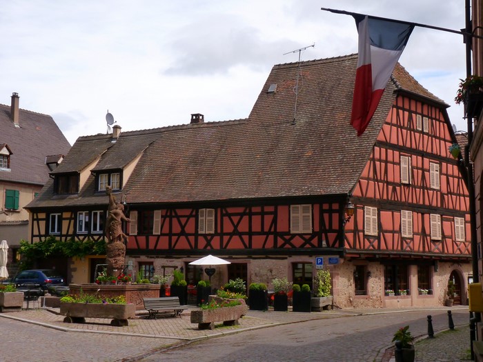 Half-timbered houses and fountain in Kientzheim, France