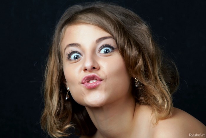 Expressive Woman with Brown Hair and Wide Eyes