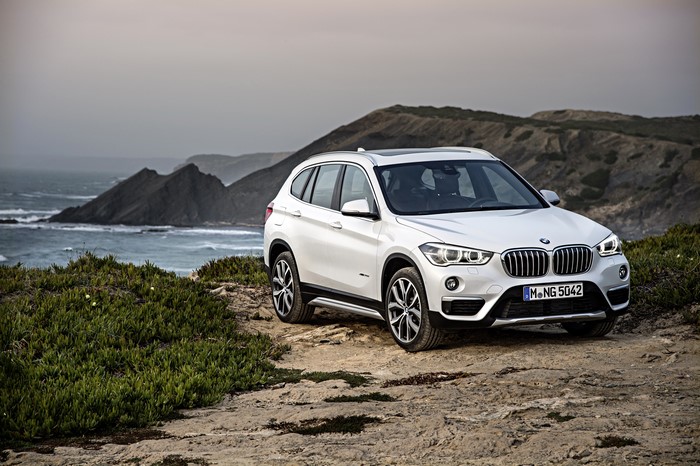White BMW X1 F48 xDrive20d on a rocky coast