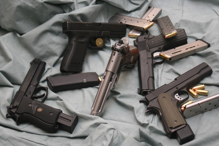 Collection of pistols and magazines