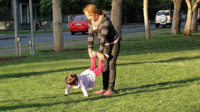 Woman holding a girl in a park in Valparaiso, Chile