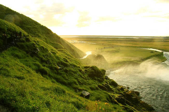 Seljalandsfoss waterfall in Iceland with green hills